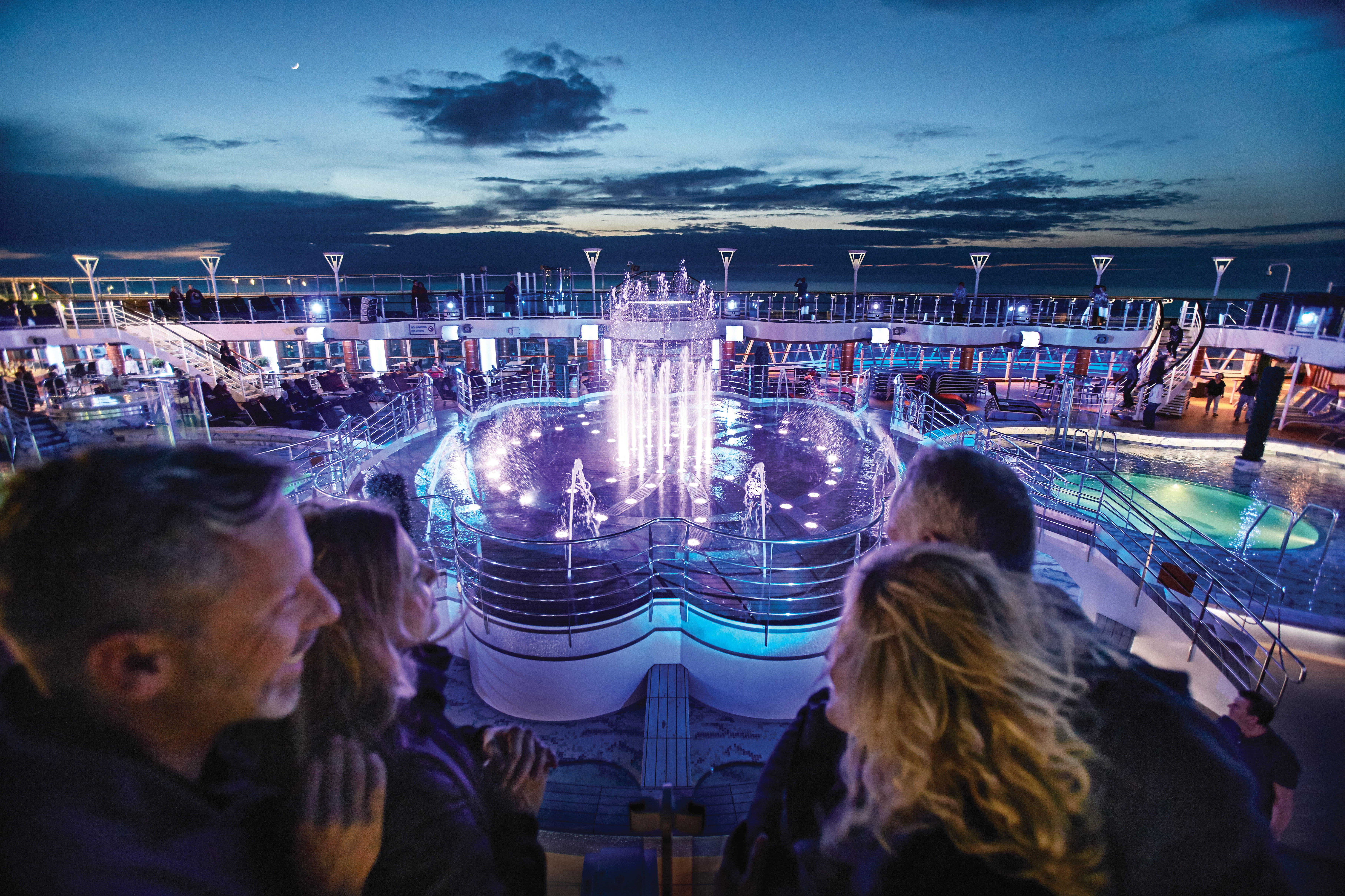 A glittering water show on the pool deck choreographed with colours and music