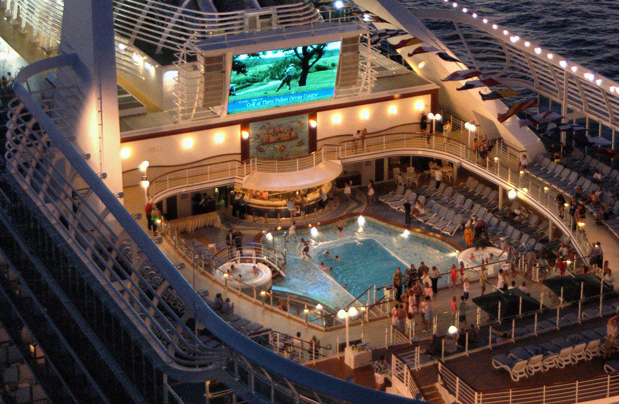 Watch a film under the stars on the pool deck