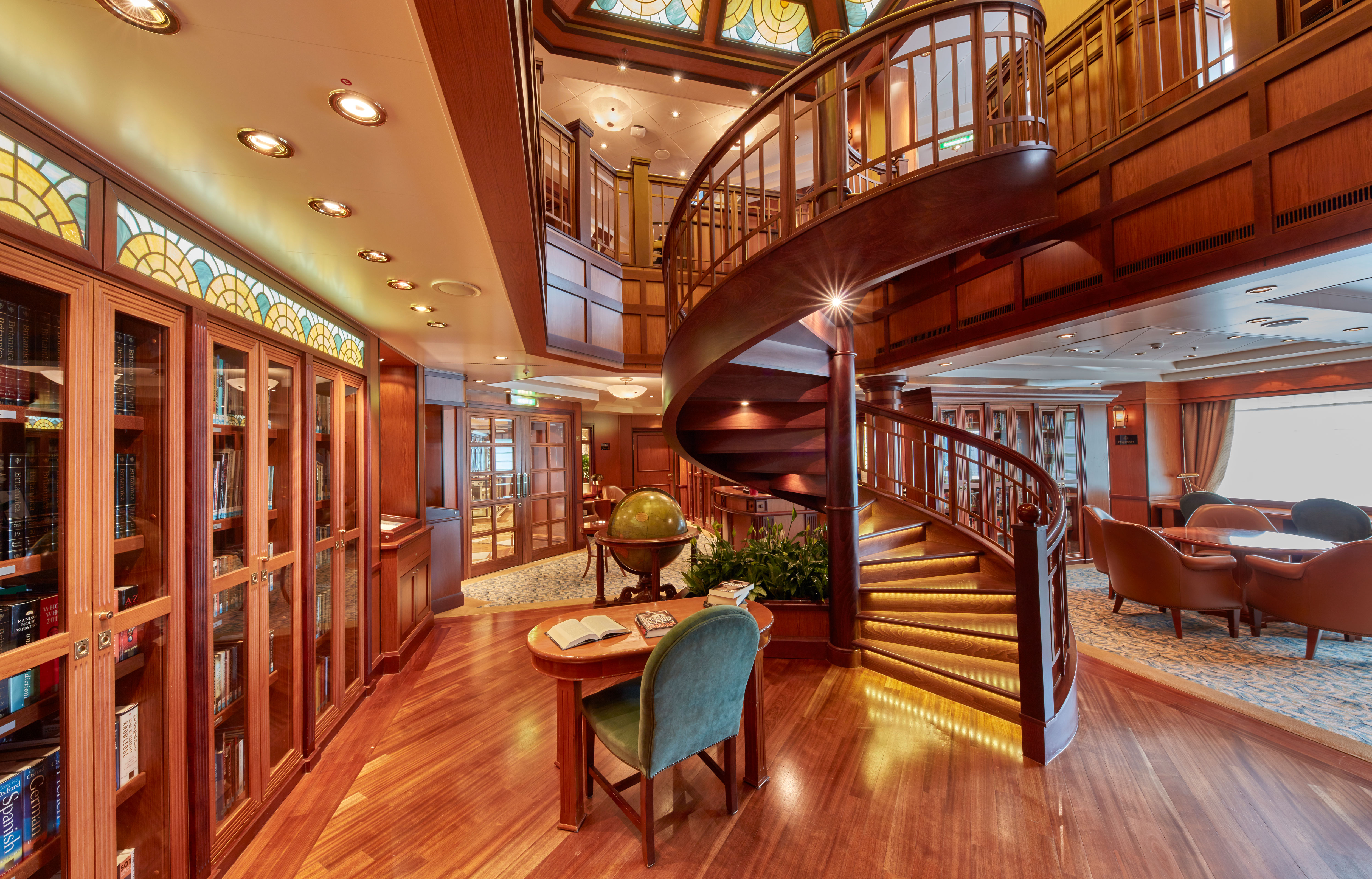 Borrow a book from the library, where over 8,000 books and magazines in the largest library at sea are at your fingertips