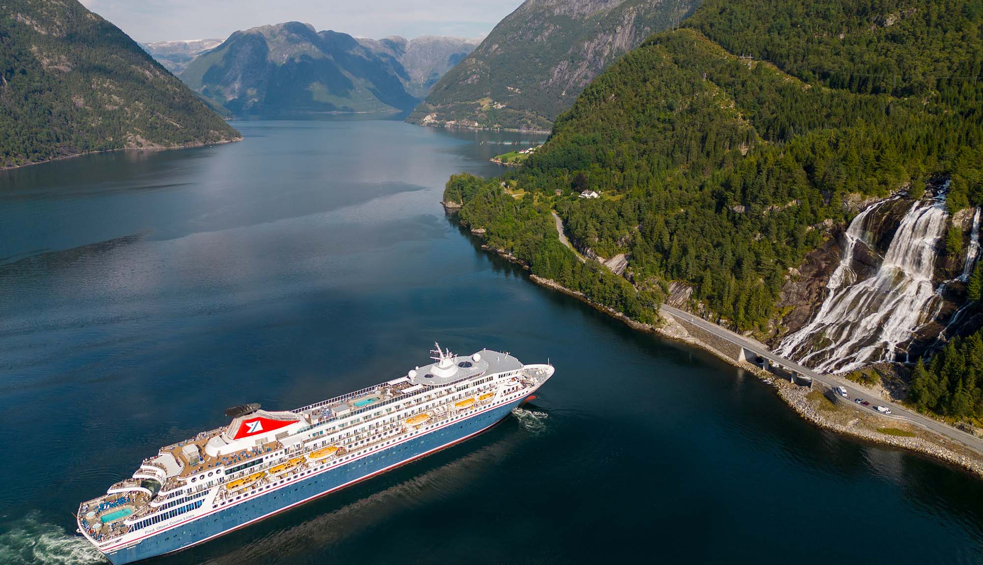 Fred Olsen Balmoral at waterfall in Norwegian Fjords