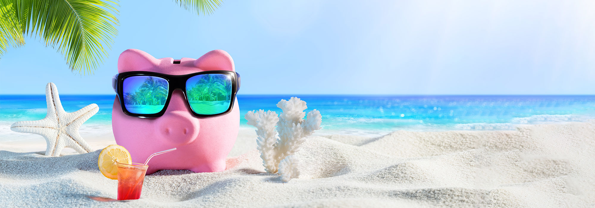 Piggy bank wearing sunglasses sipping on a cocktail at the beach, feeling smug because they found a cheap cruise deal at Southampton Cruise Centre