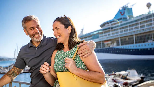 Couple stepping ashore from their Marella cruise ship