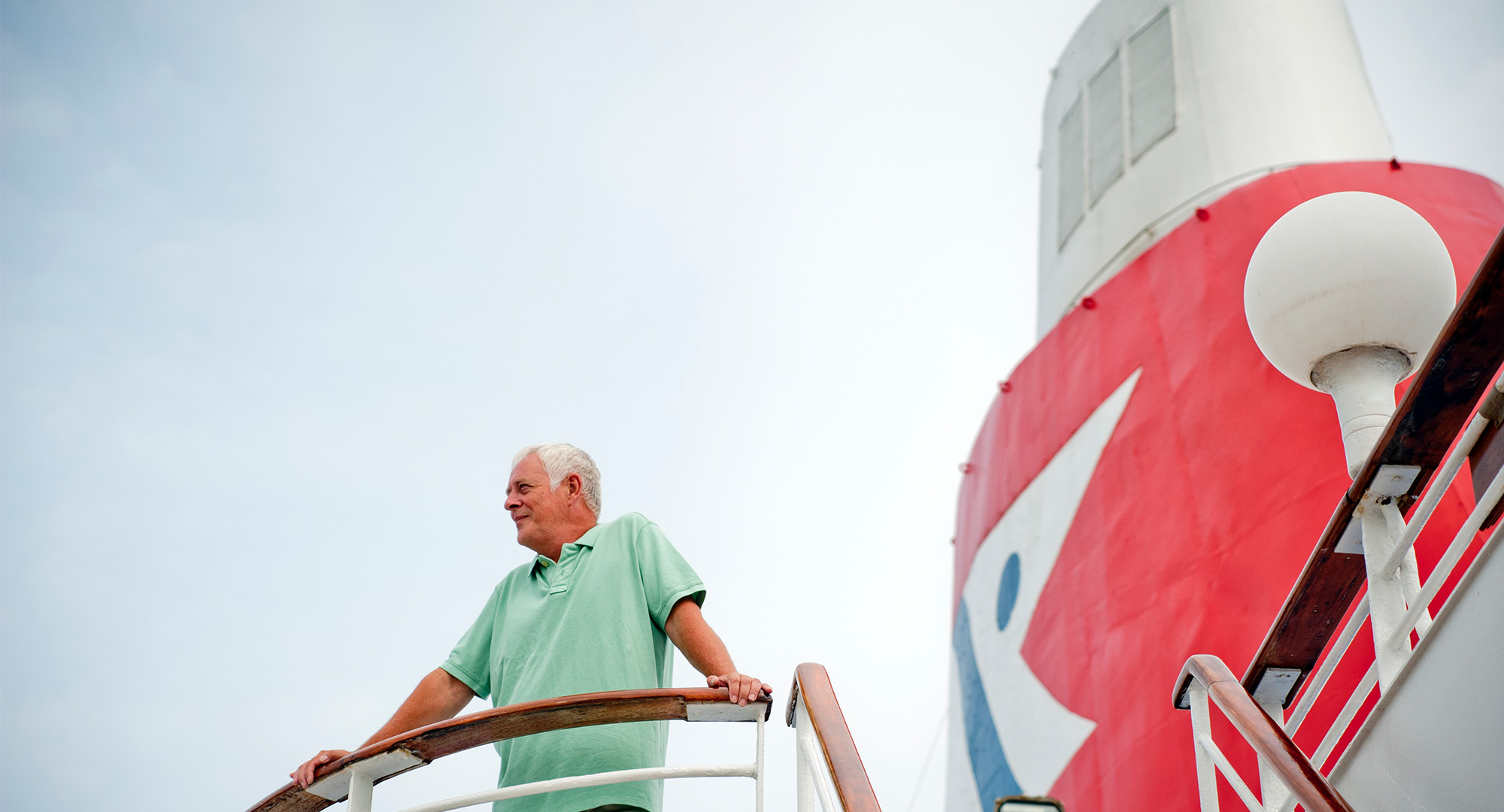 Man taking in the view from a Fred Olsen ship