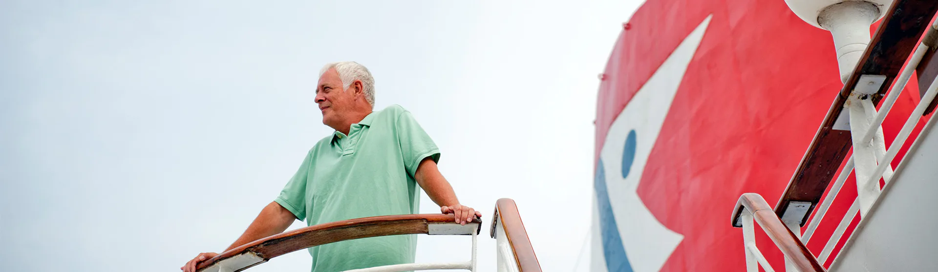 Man taking in the view from a Fred Olsen ship