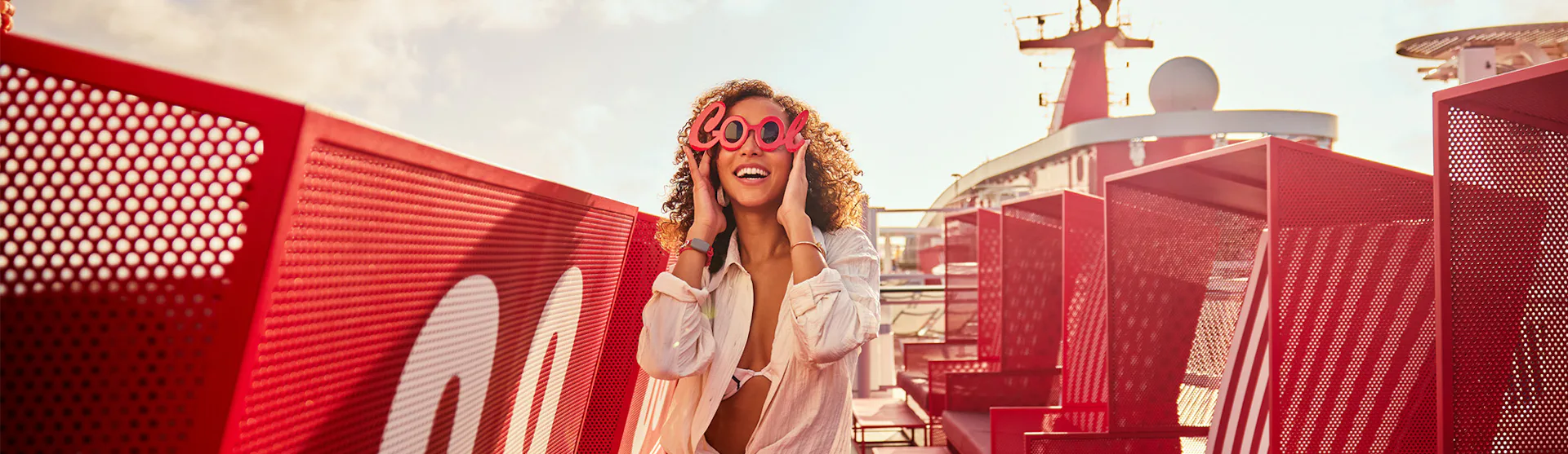 Woman chilling on top deck on one of Virgin Voyages' ladyships