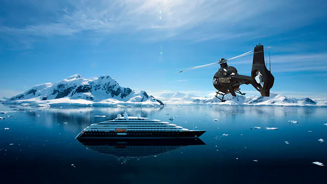 Scenic Eclipse and helicopter in Antarctica