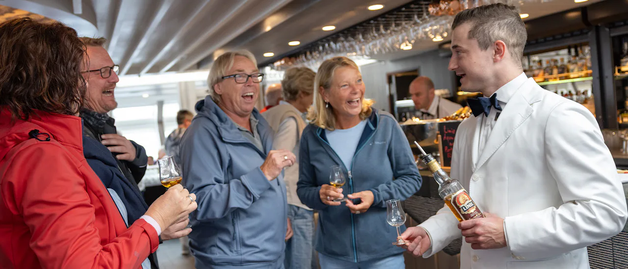 Happy customers toasting in the bar
