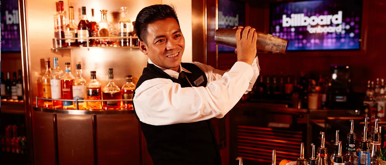 Bartender smiling at the Billboard Bar