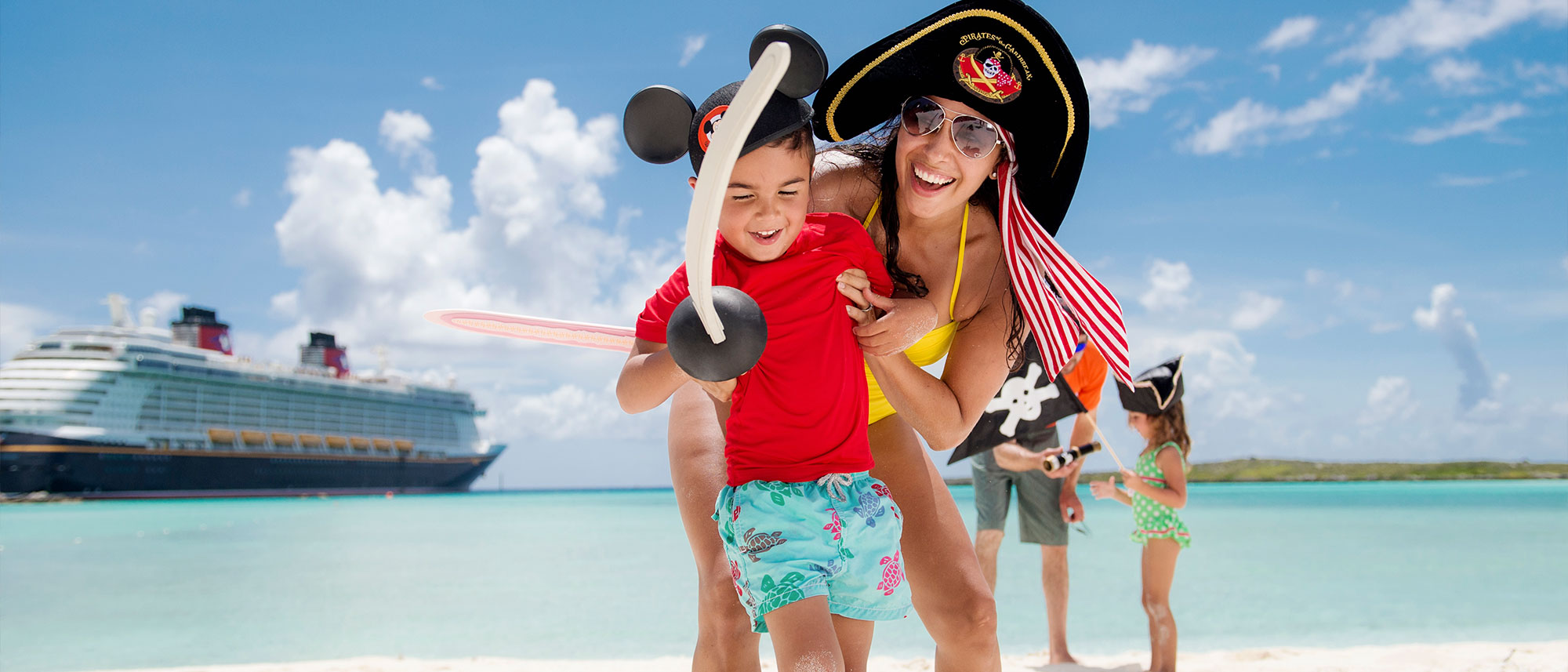 Family on the beach at Castaway Cay
