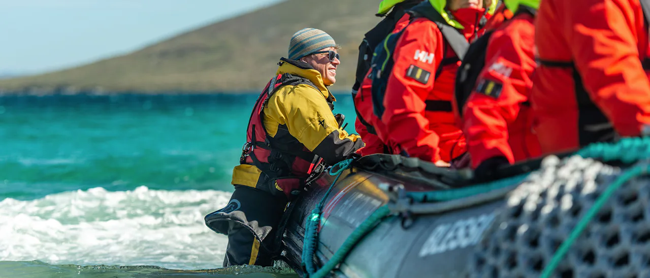 A HX guide escorting a zodiac excursion