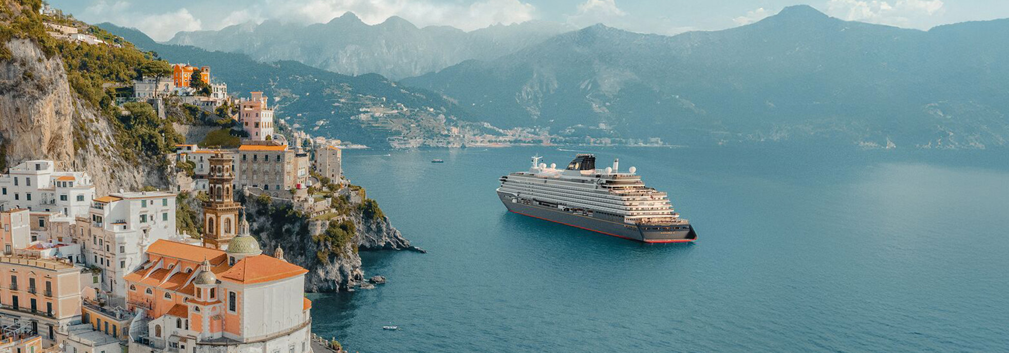 Explora Journeys ship sailing past the Amalfi Coast