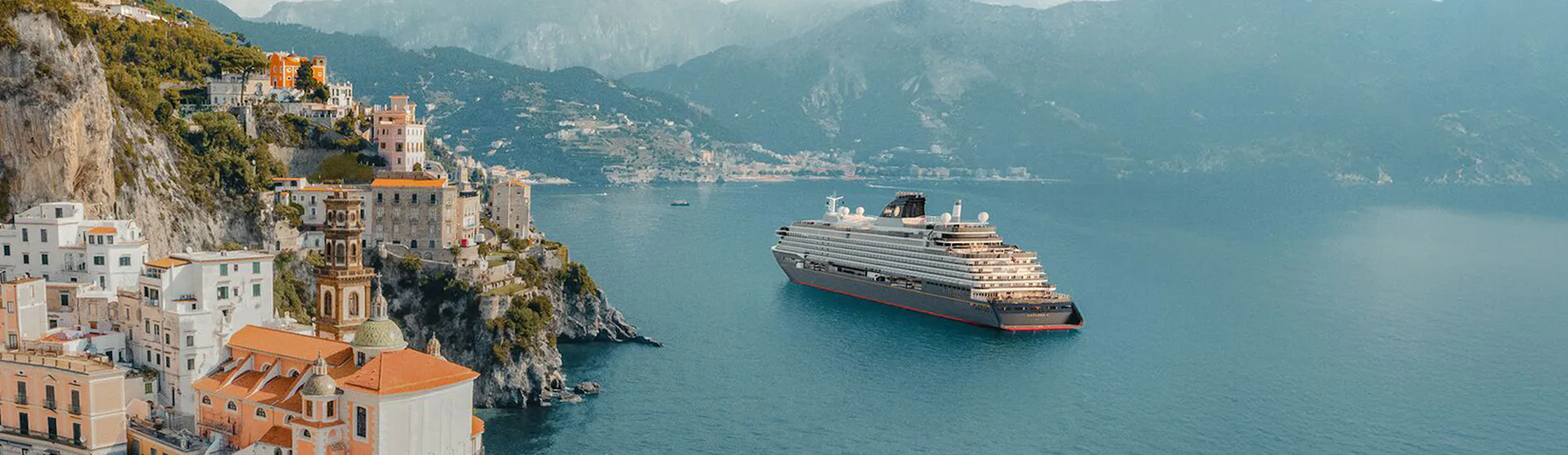 Explora Journeys ship sailing past the Amalfi Coast