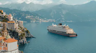 Explora Journeys ship sailing past the Amalfi Coast