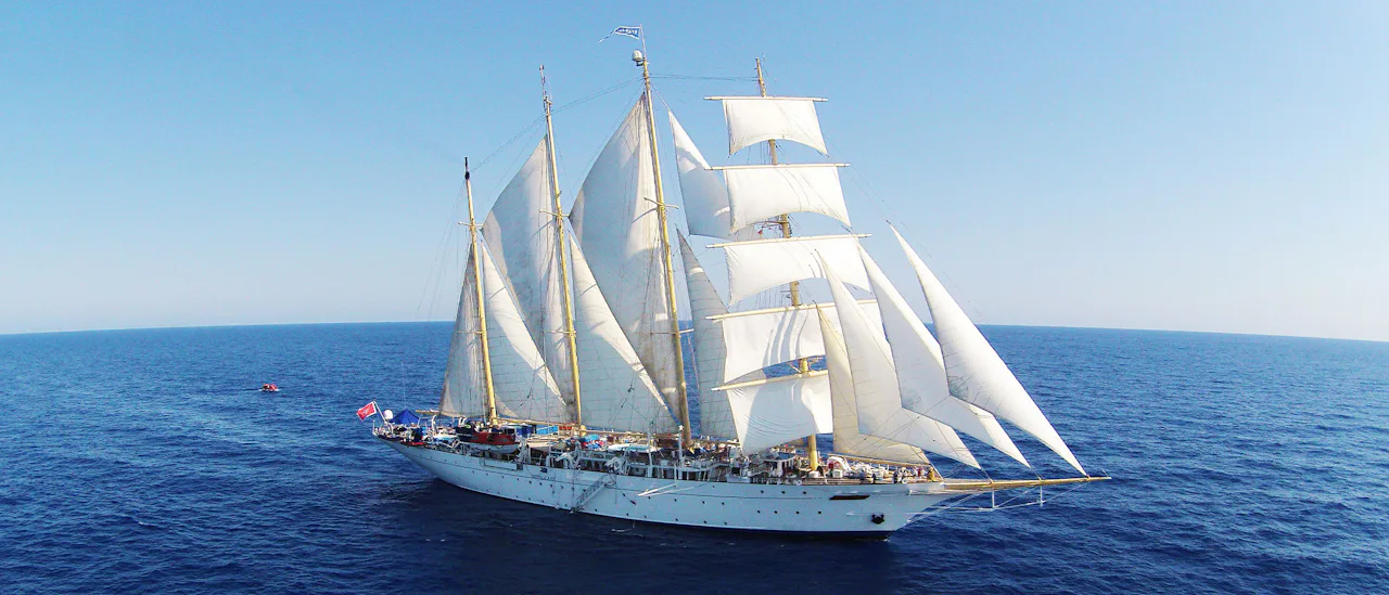 Star Clipper ship with sails up at sea