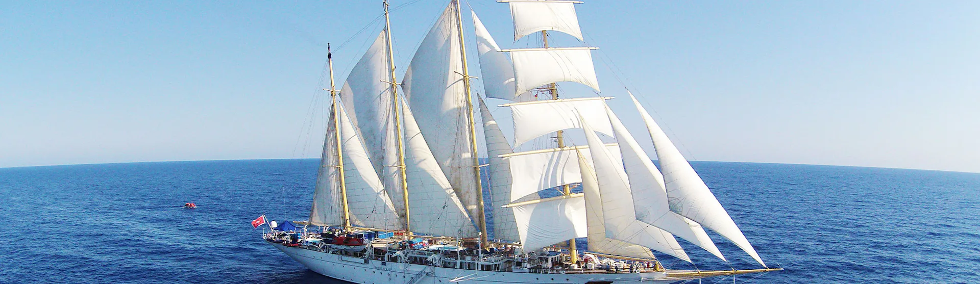 Star Clipper ship with sails up at sea