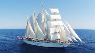 Star Clipper ship with sails up at sea