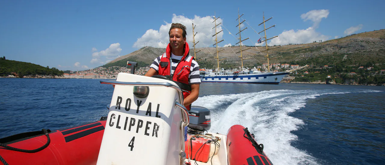 Guest driving Royal Clipper boat