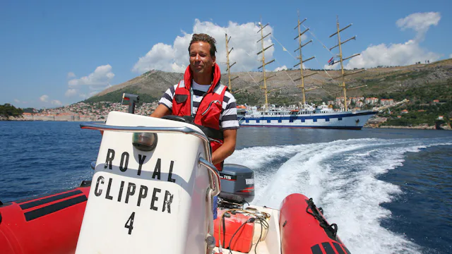 Guest driving Royal Clipper boat