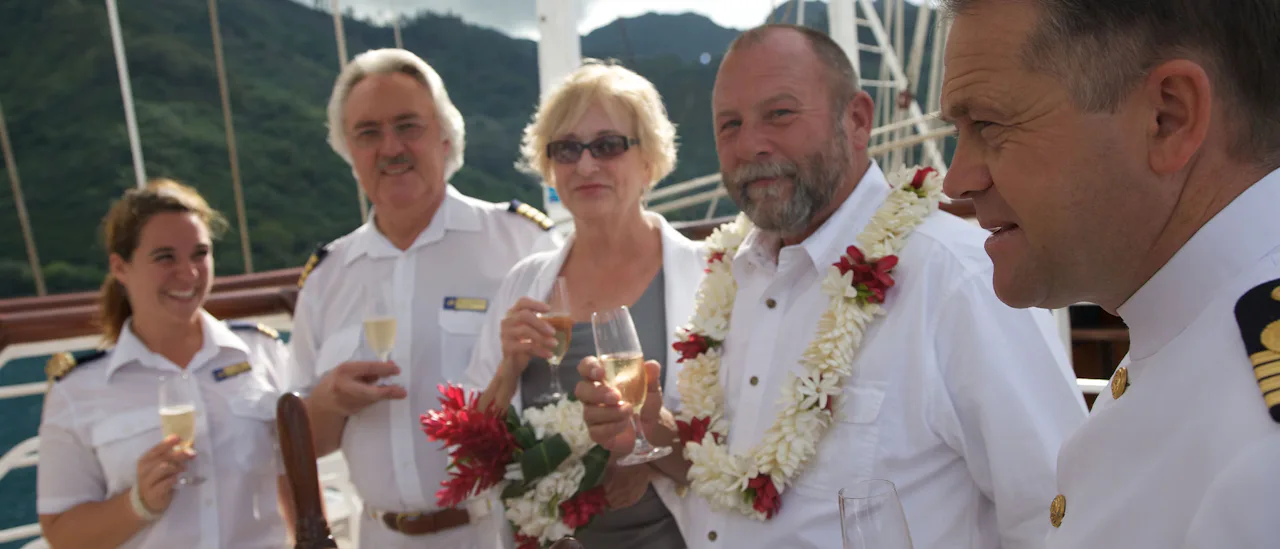 Star Clipper guests toasting with the crew