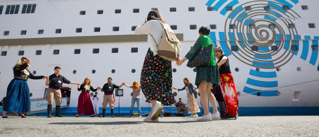 Greek dancers welcoming guests onboard