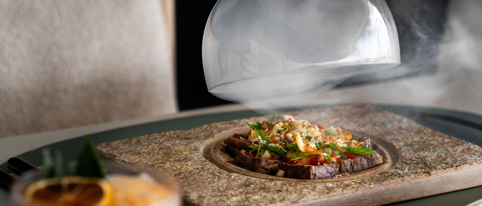 A smoked dish being served at the Beach House