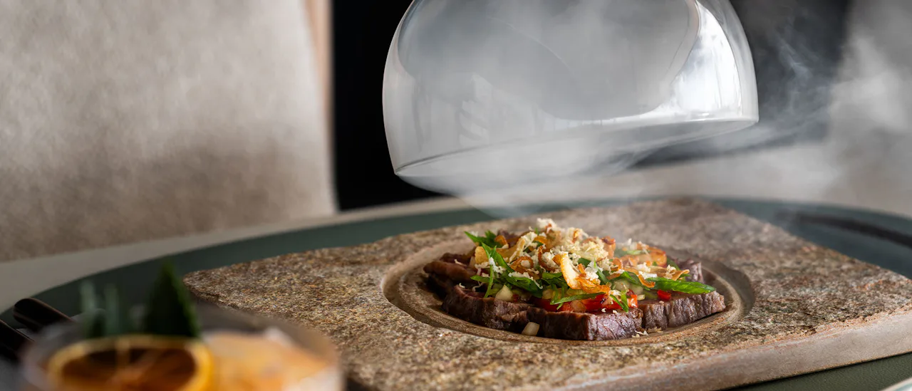 A smoked dish being served at the Beach House