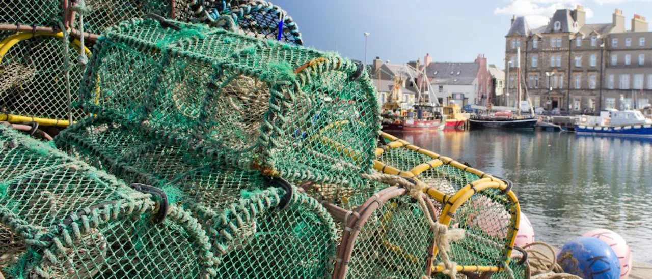 Lobster pots stacked on the dock in Kirkwall, Orkney Islands