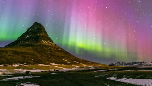 The Northern Lights above Kirkjufell in Iceland