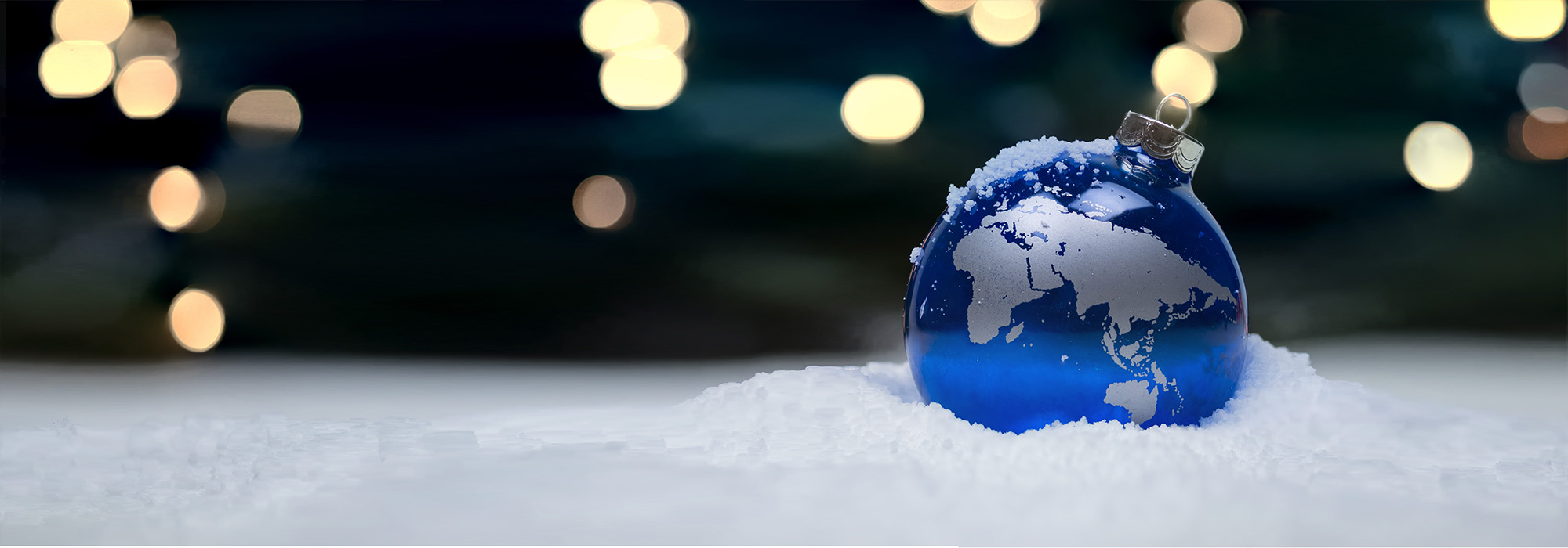 A Christmassy setting with a world globe bauble 