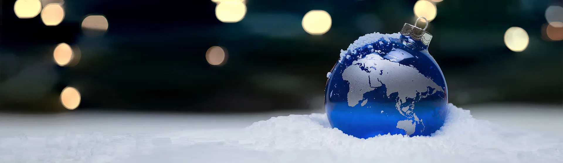 A Christmassy setting with a world globe bauble