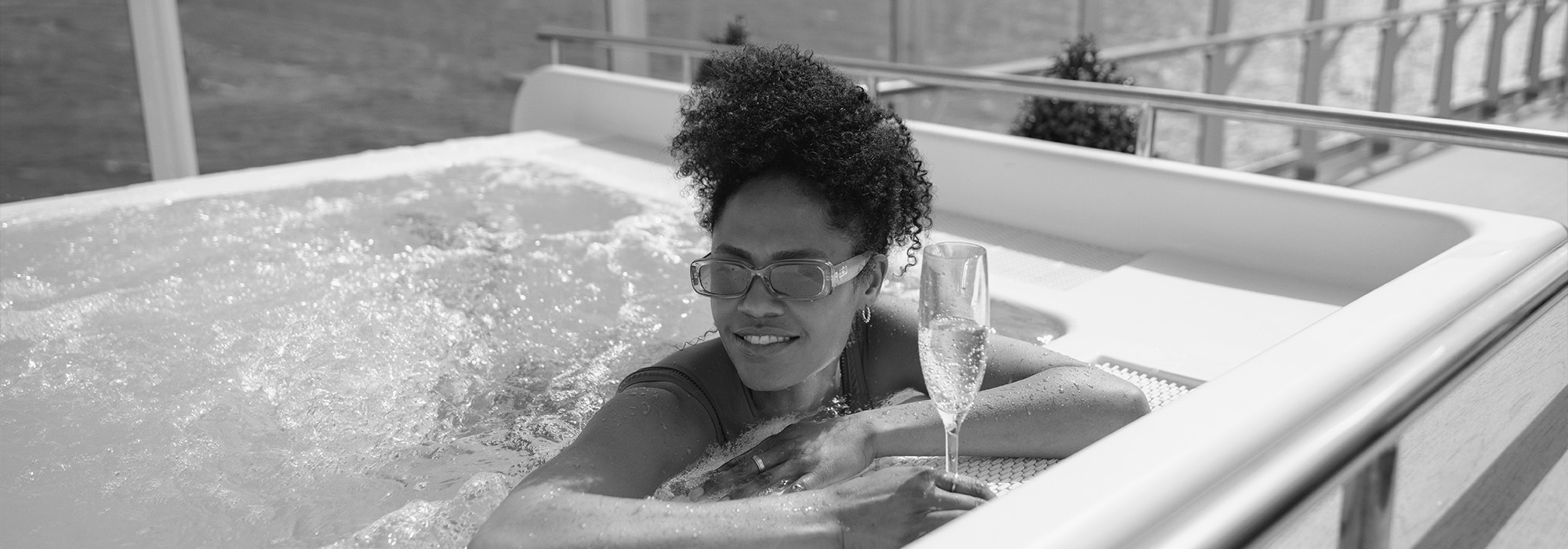 Women enjoying the hot tub on the Grills Terrace