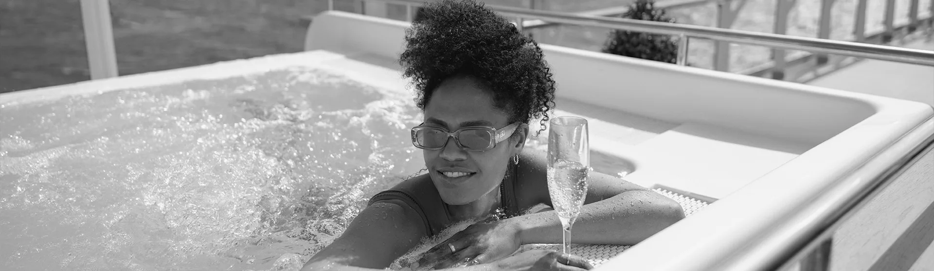 Women enjoying the hot tub on the Grills Terrace