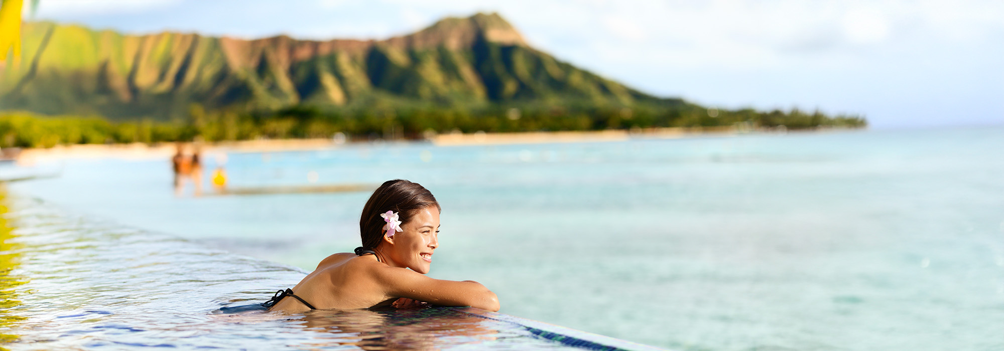 Woman in infinity pool in Kaui, Hawaii