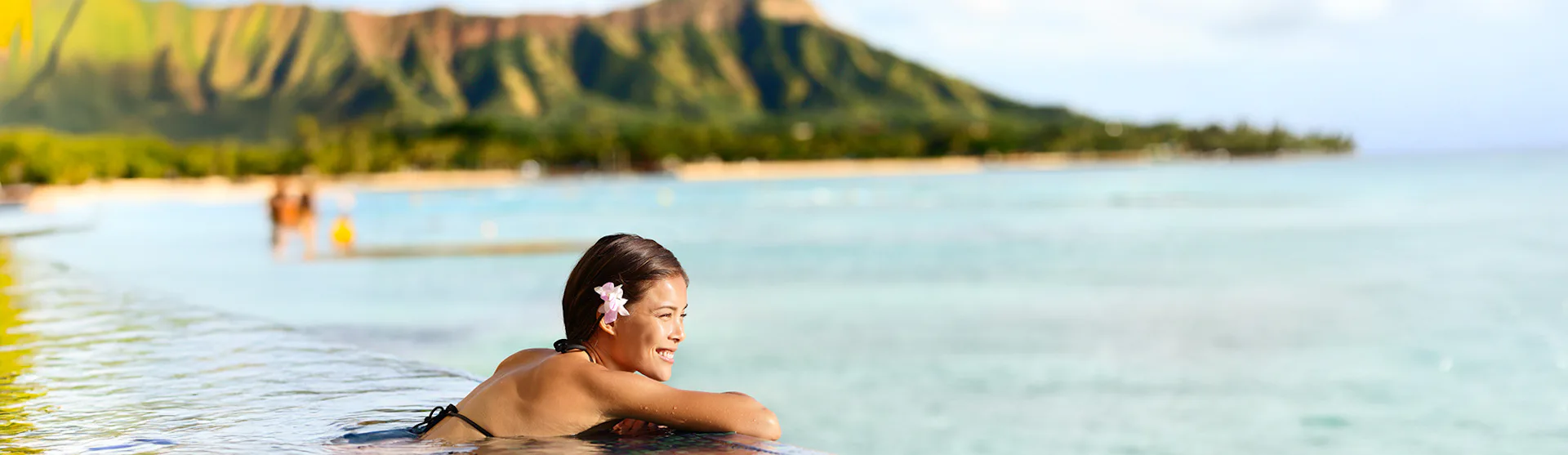 Woman in infinity pool in Kaui, Hawaii