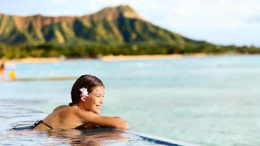 Woman in infinity pool in Kaui, Hawaii