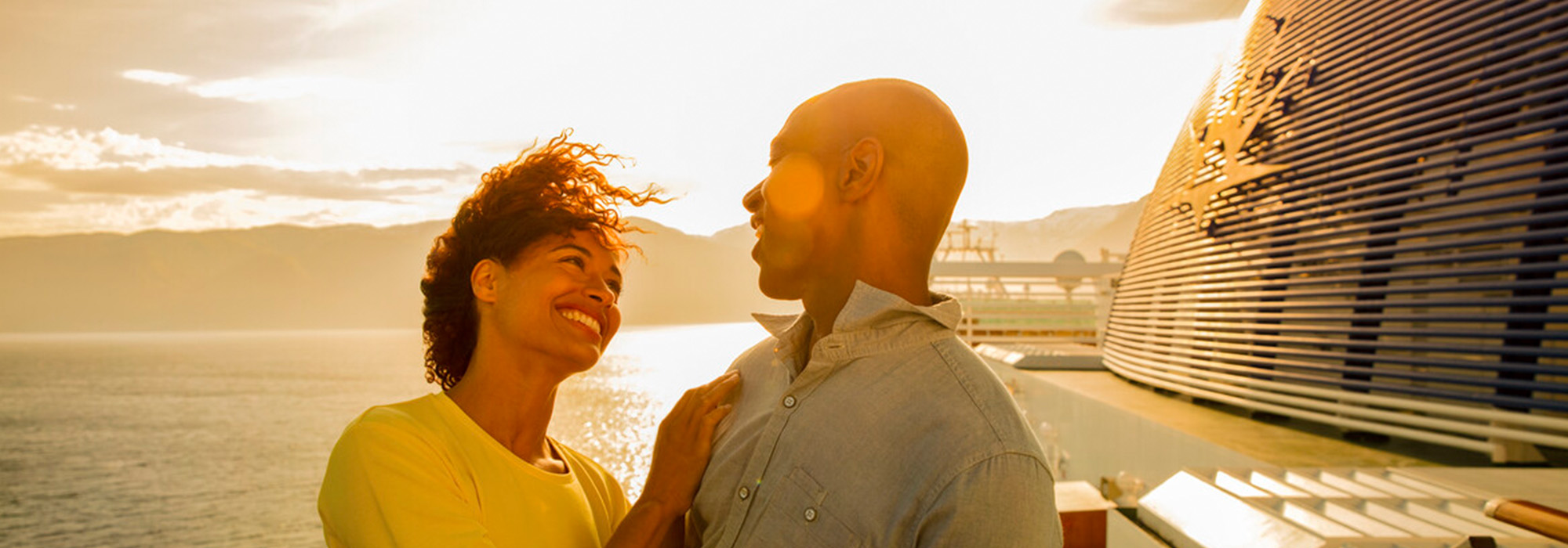 Couple enjoying the sunset on a P&O Cruises ship