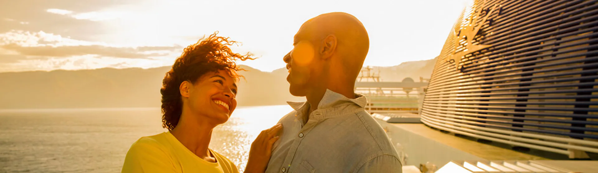 Couple enjoying the sunset on a P&O Cruises ship