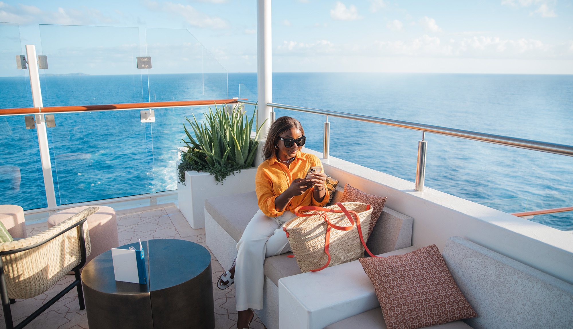 Celebrity Cruises - Lady chilling at the Sunset Bar on Celebrity Beyond