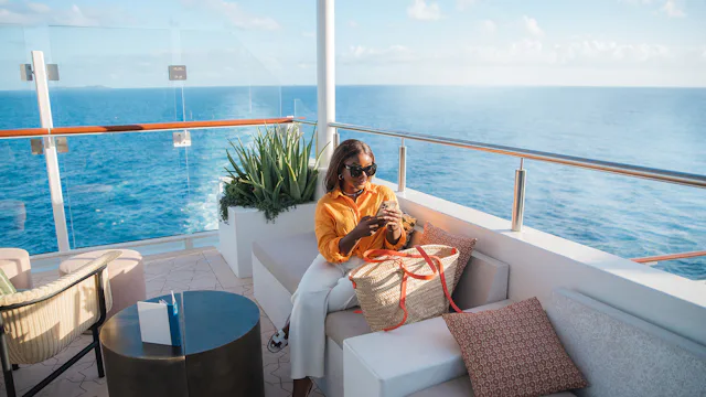 Celebrity Cruises - Lady chilling at the Sunset Bar on Celebrity Beyond