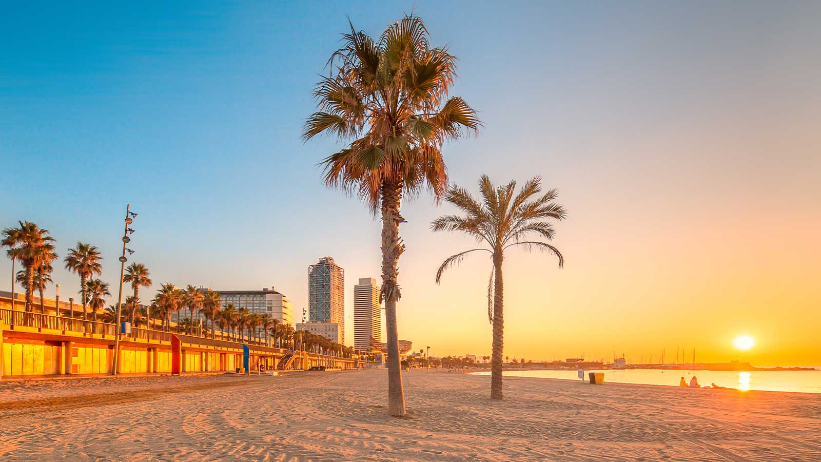 Sunset in the evening on a Barcelona beach