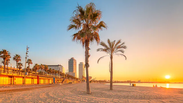 Sunset in the evening on a Barcelona beach