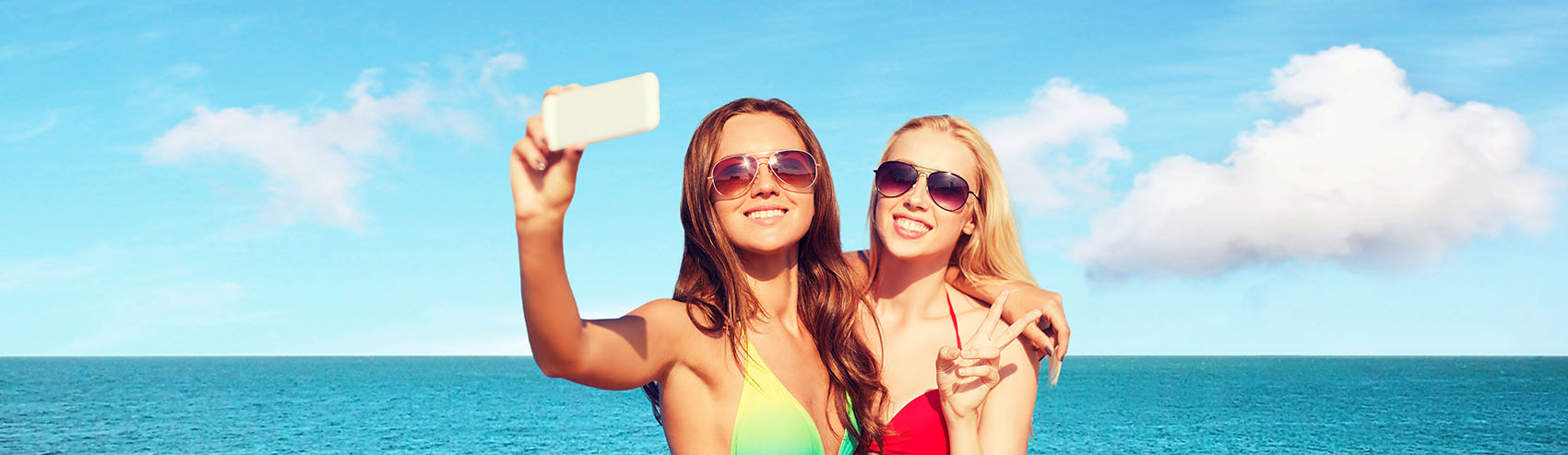 Ladies taking a selfie at sea