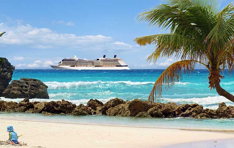 Caribbean beach with cruise ship at sea