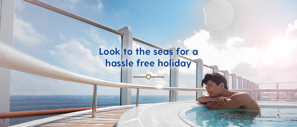 Man gazing out to see in a hot tub on deck