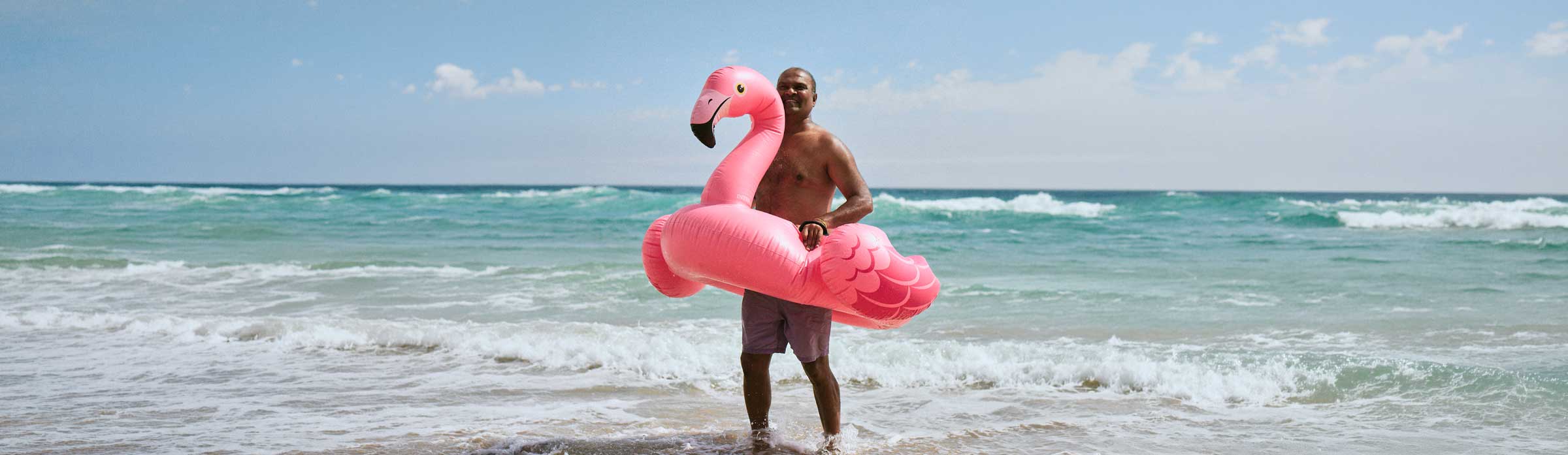 Staysure Insurance man on beach