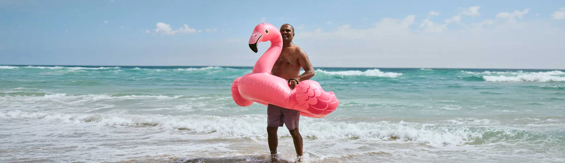 Staysure Insurance man on beach